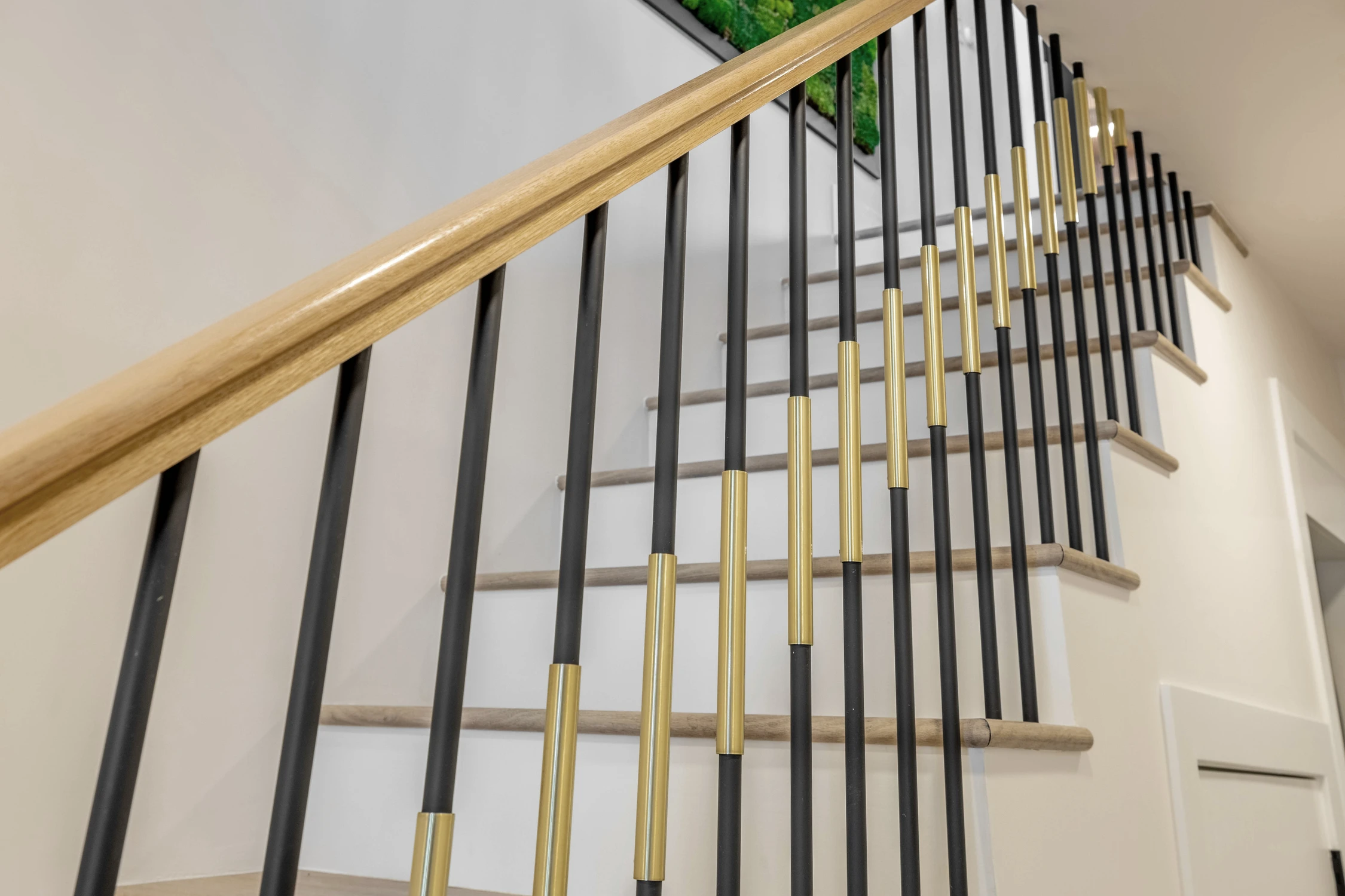 Stair railing against a light neutral wall