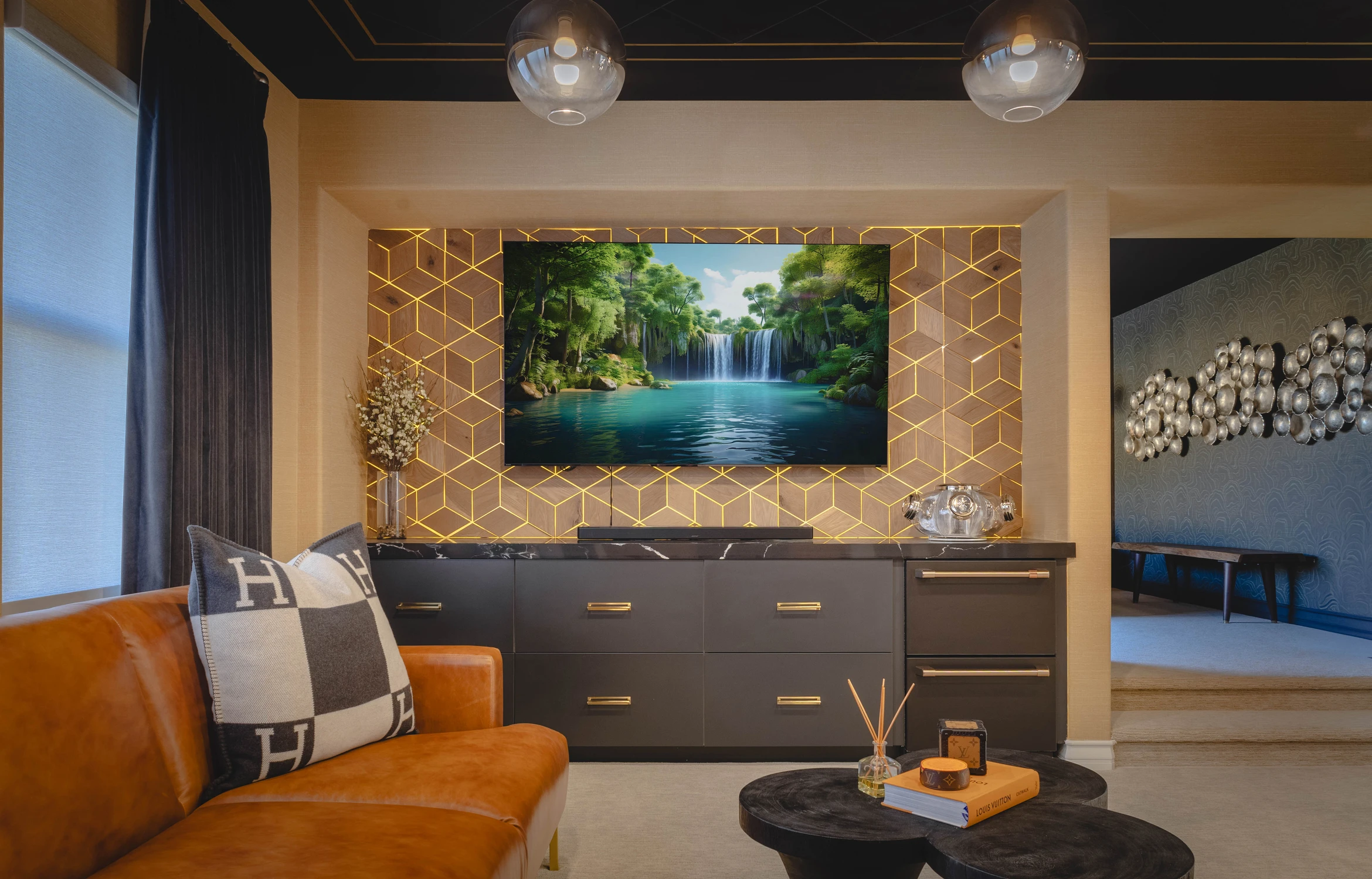 Media wall with illuminated geometric wood surround and television