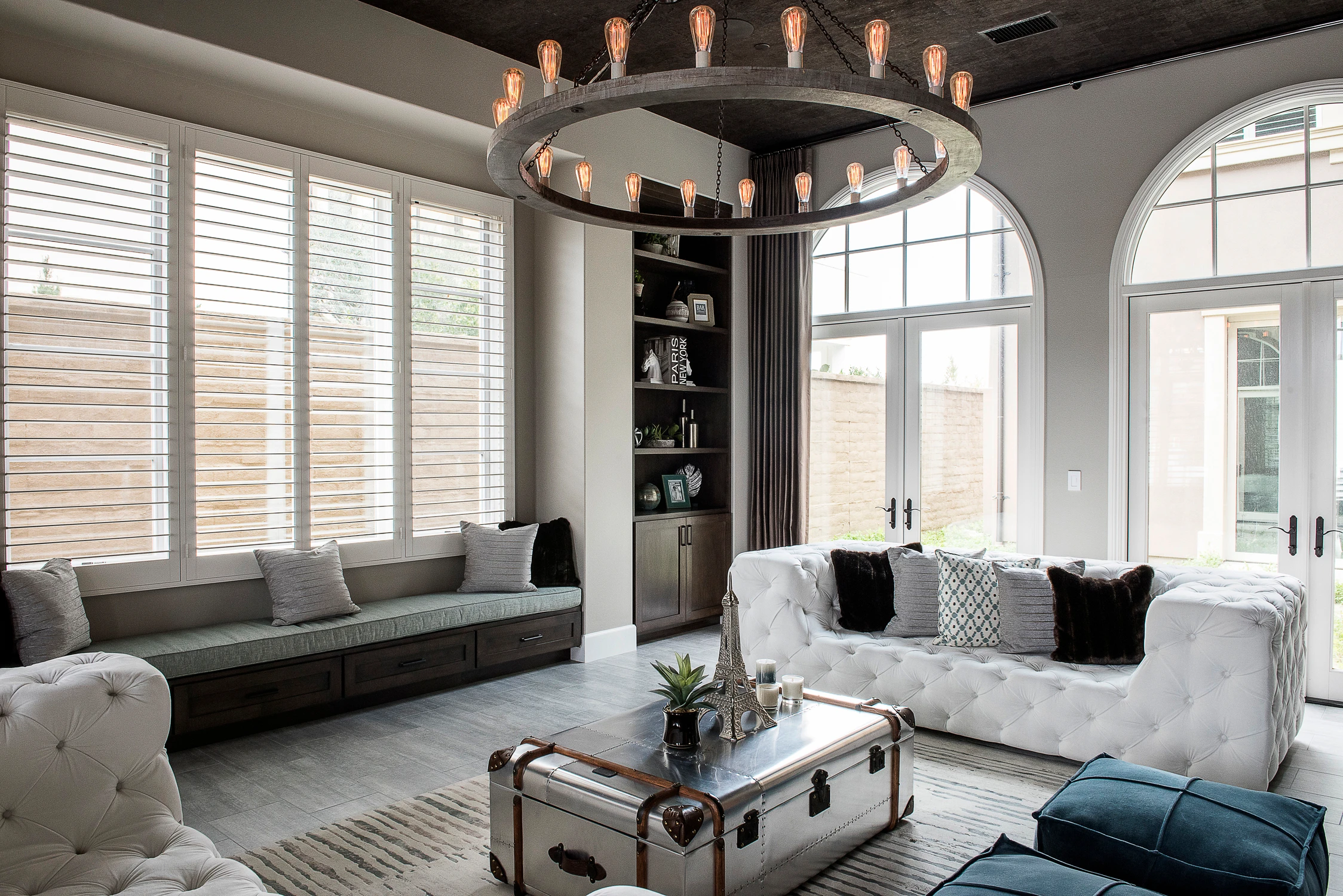 Formal living room with white tufted sofas and black ceiling