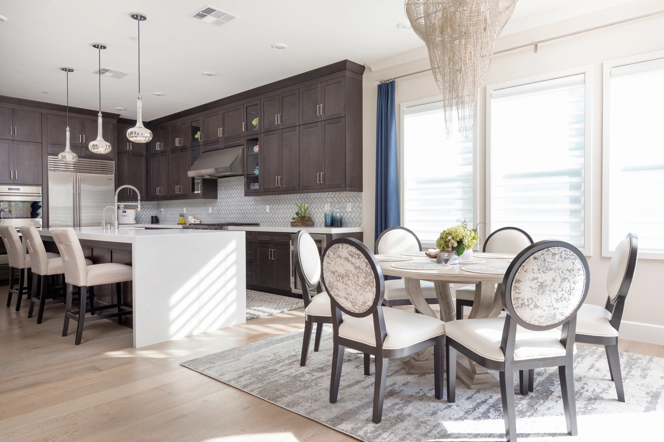 Dark kitchen with white island and patterned runner