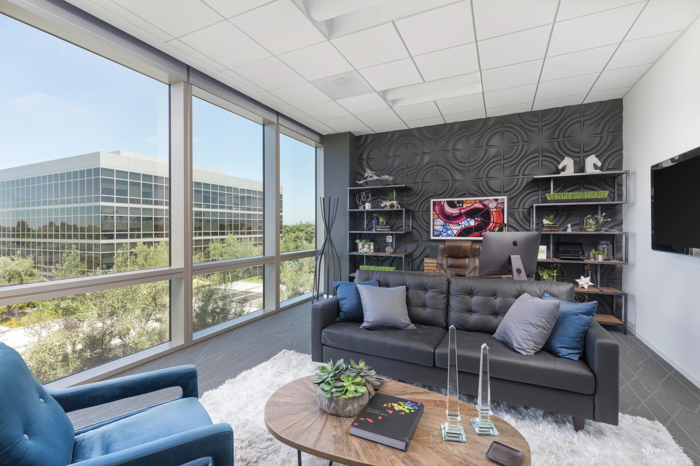 Software company office lounge with black feature wall and skyline windows