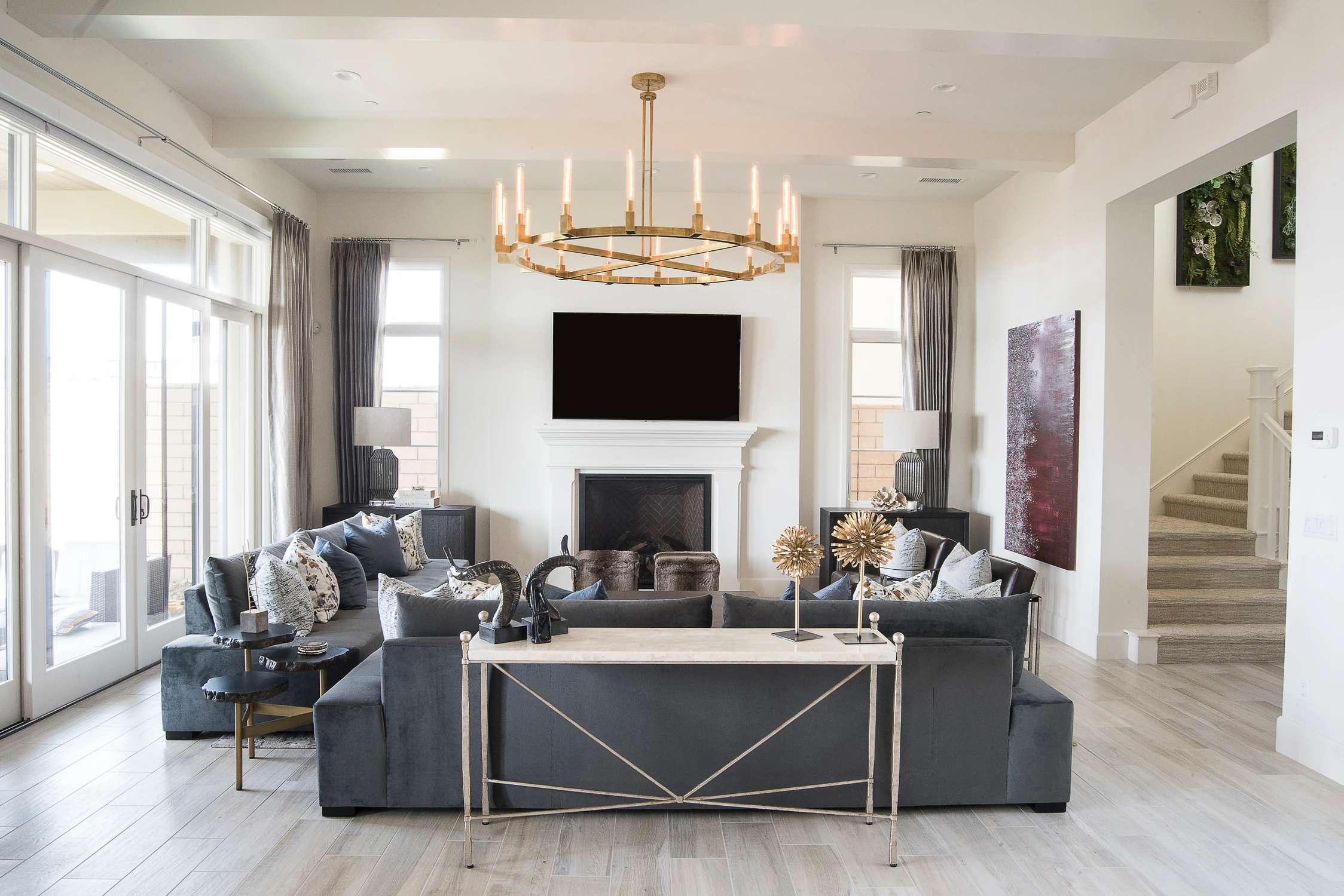 Living room side table between gray seating and fireplace