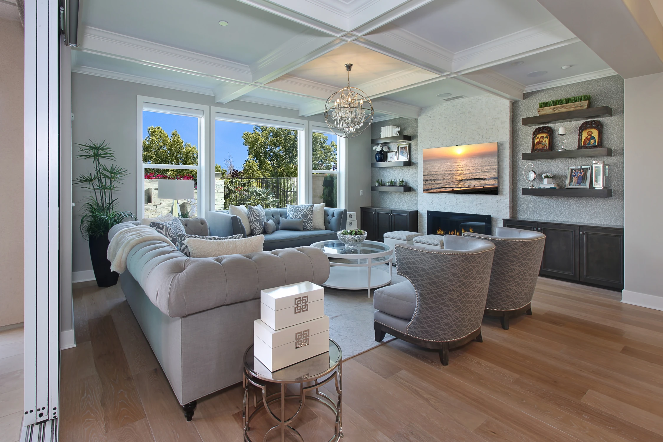 Living room with pale sectional, white fireplace, and dark built-ins
