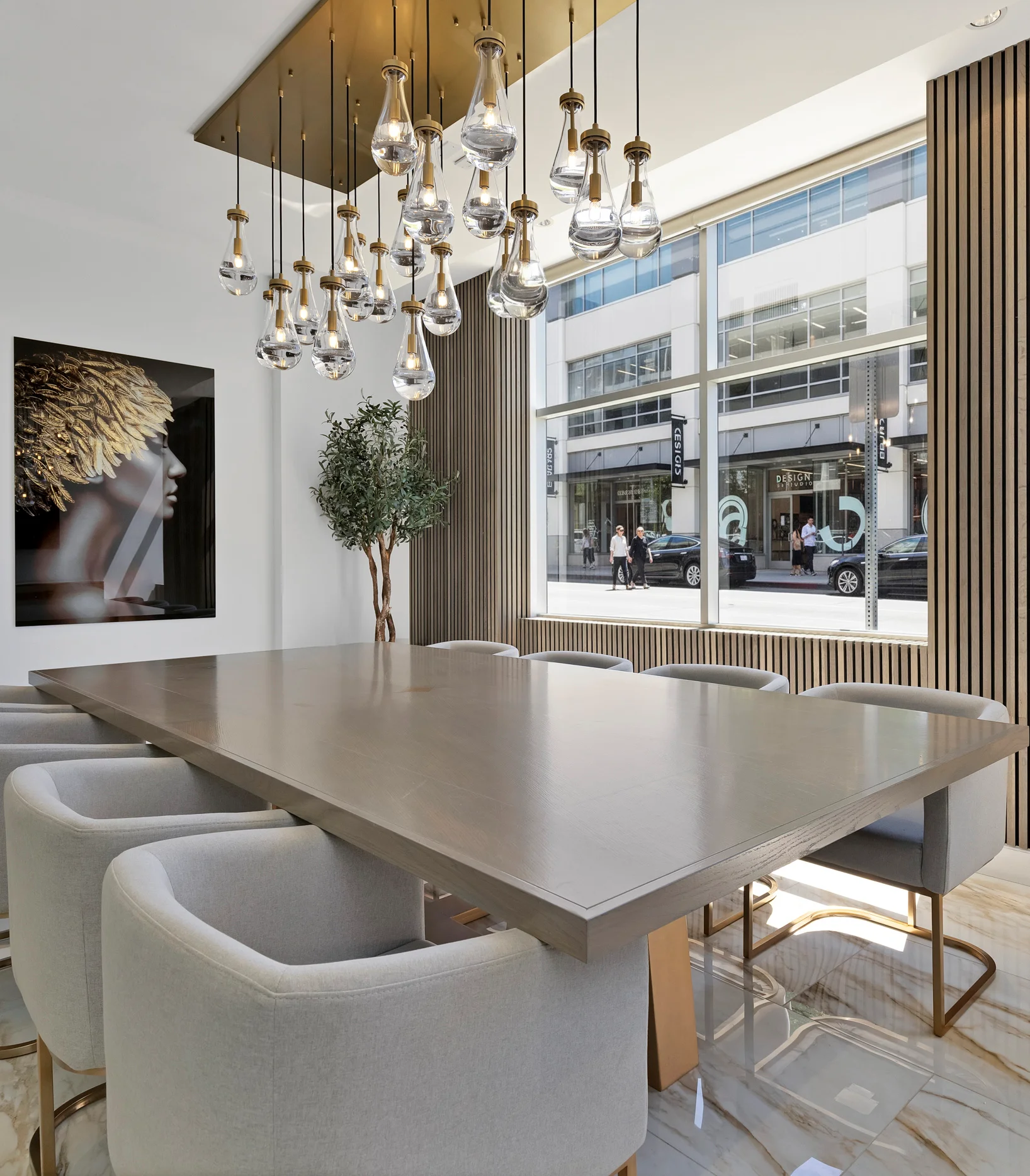 Office meeting room with crystal lighting, wood paneling and gold accents