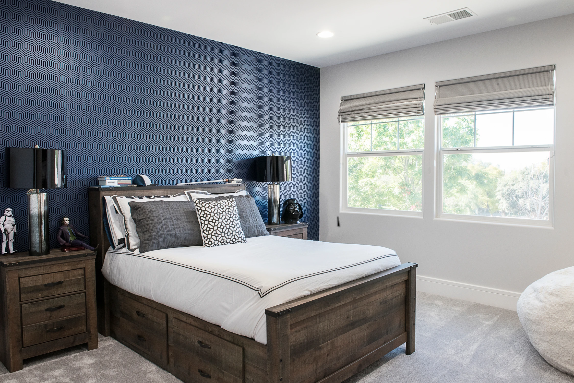 Kids' bedroom with wood bed and blue geometric accent wall