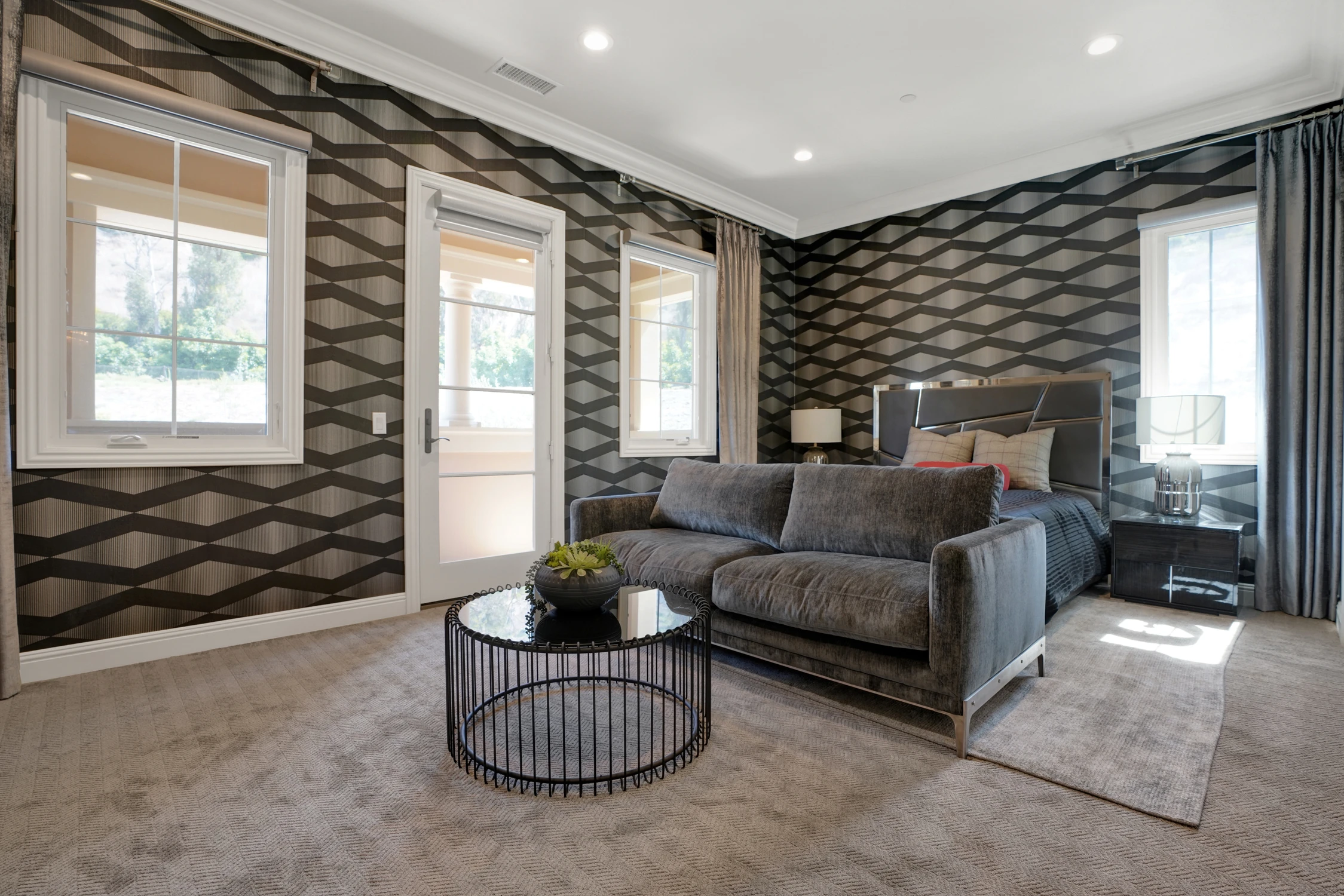 Gray living room with large geometric wall mirror