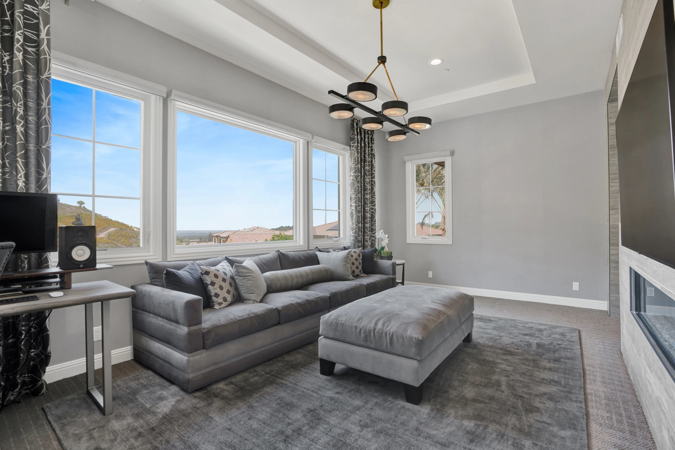 Gray living room with sectional sofa and built-in media wall