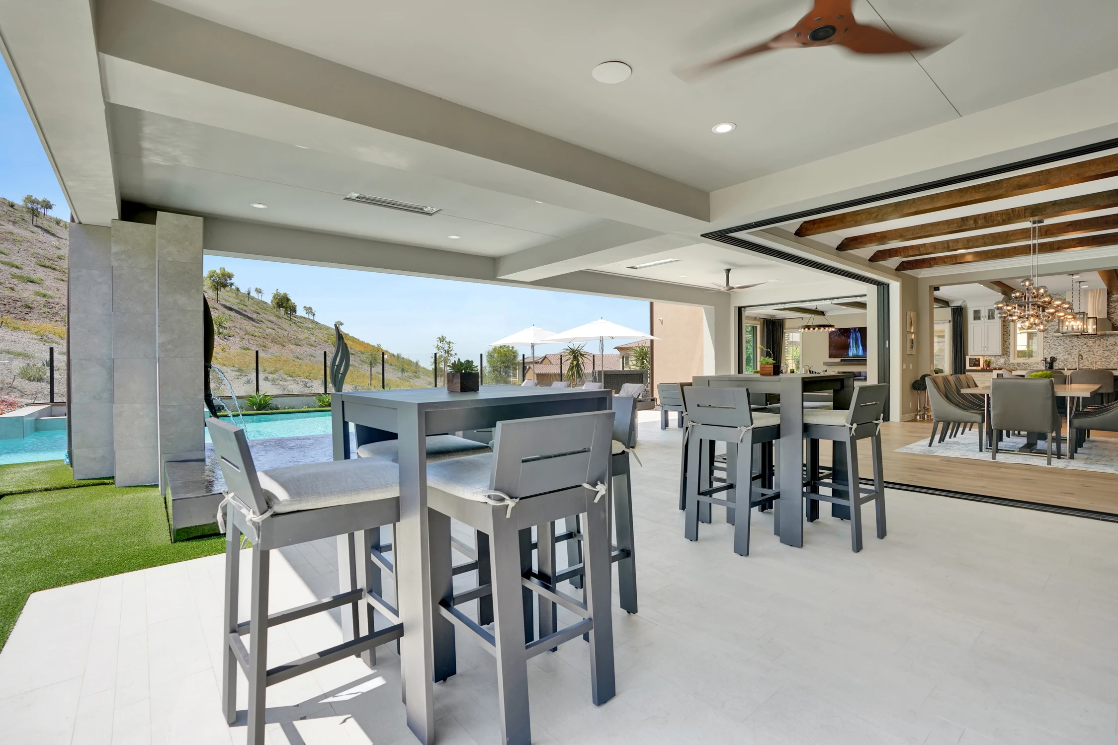 Poolside patio with lounge chairs and outdoor seating
