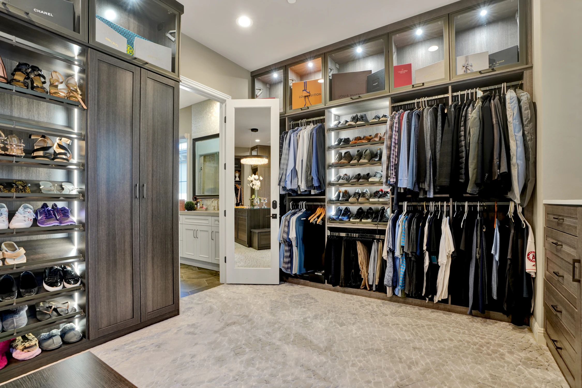 Closet dressing area with wood drawers and long counter