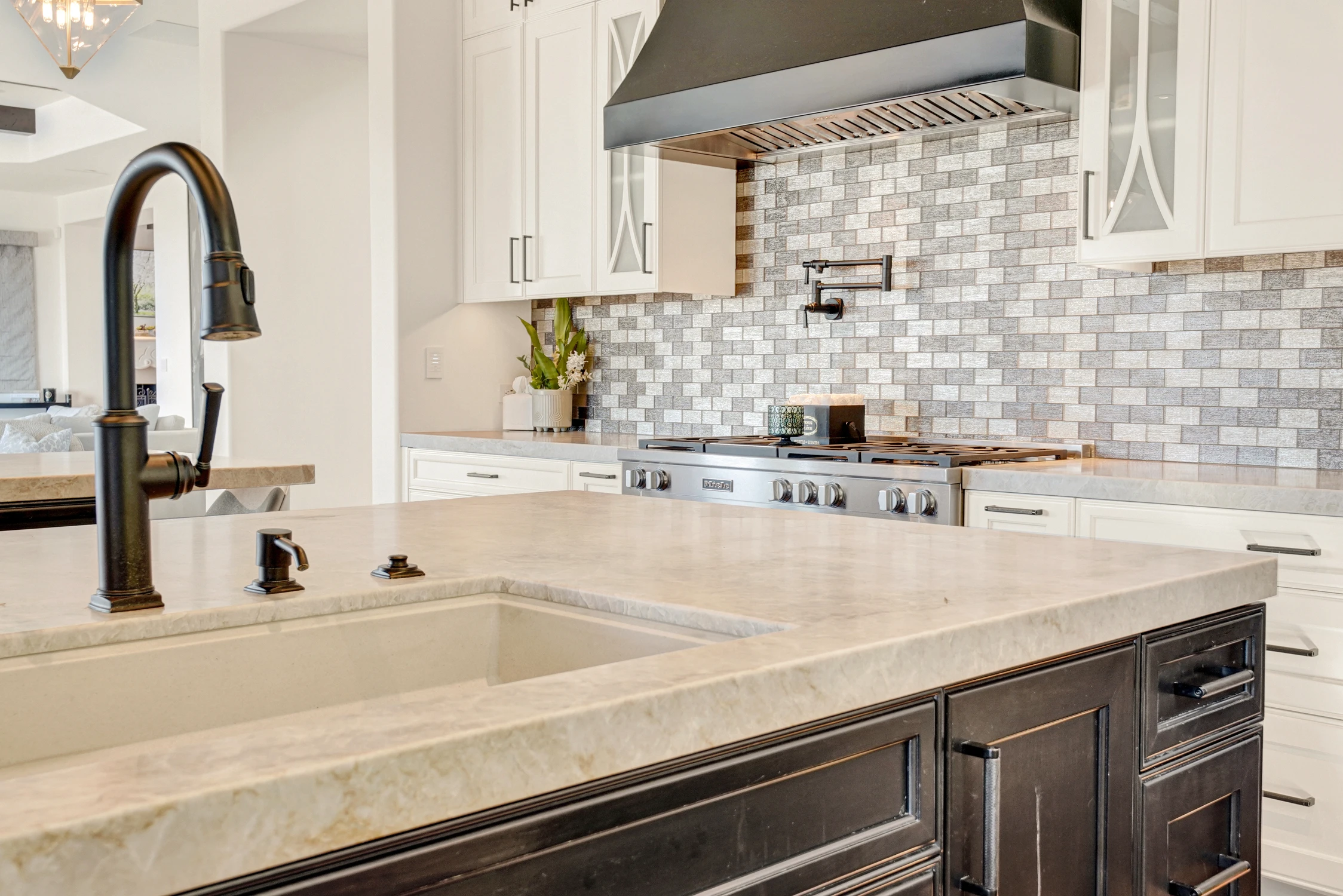 Kitchen counter with deep sink and mosaic tile backsplash