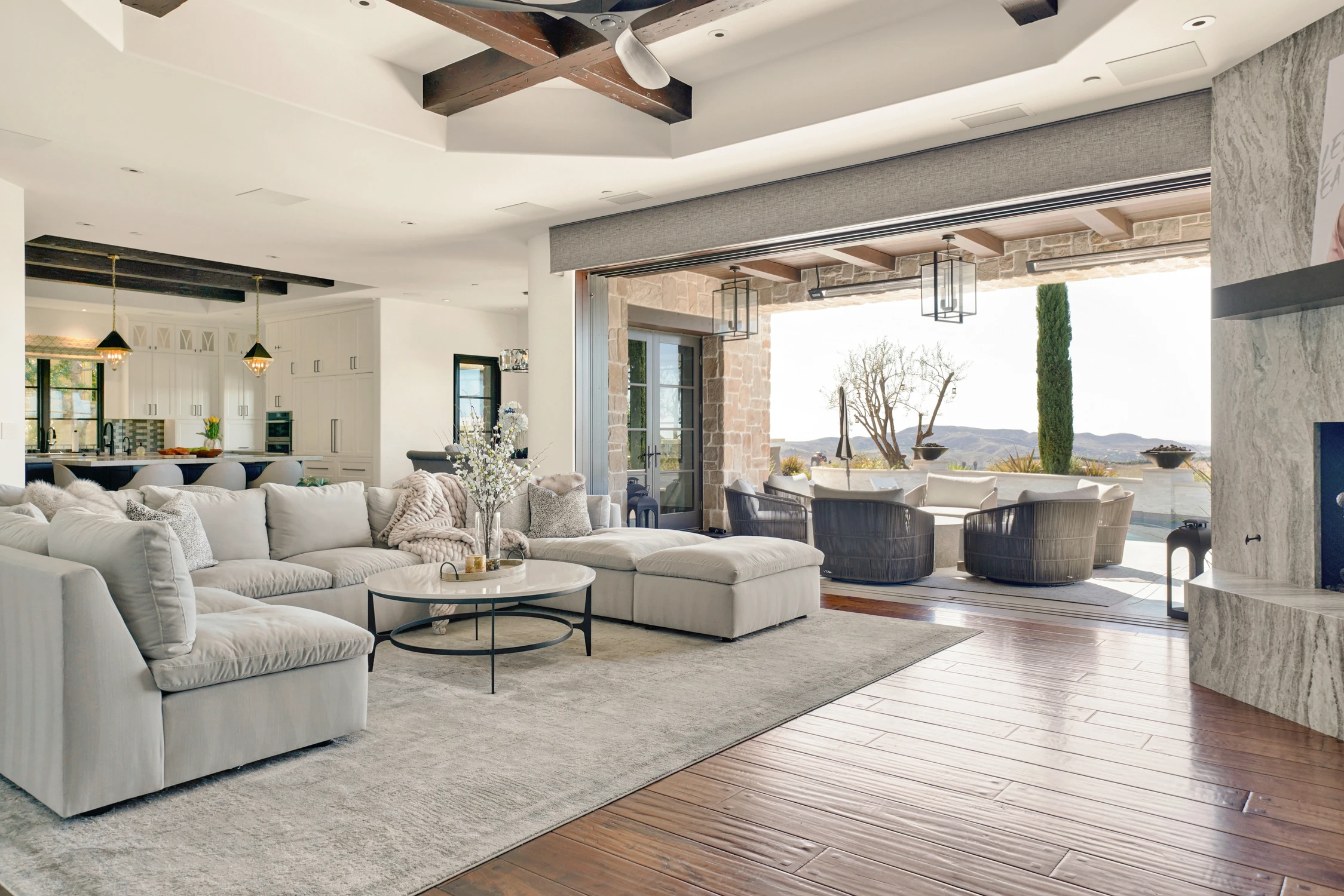 Living room with white sectional and modern fireplace