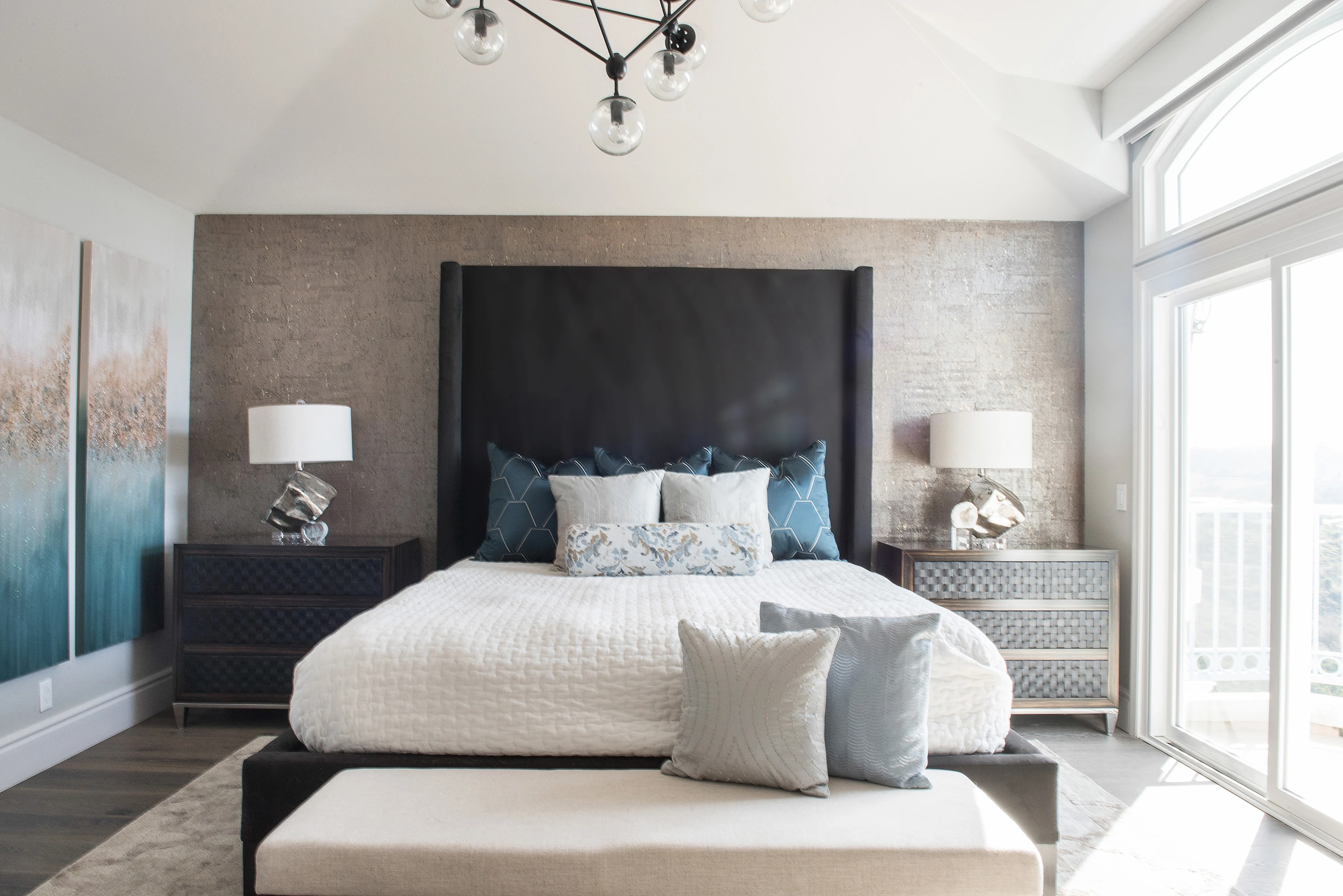 King bed with an oversized black upholstered headboard