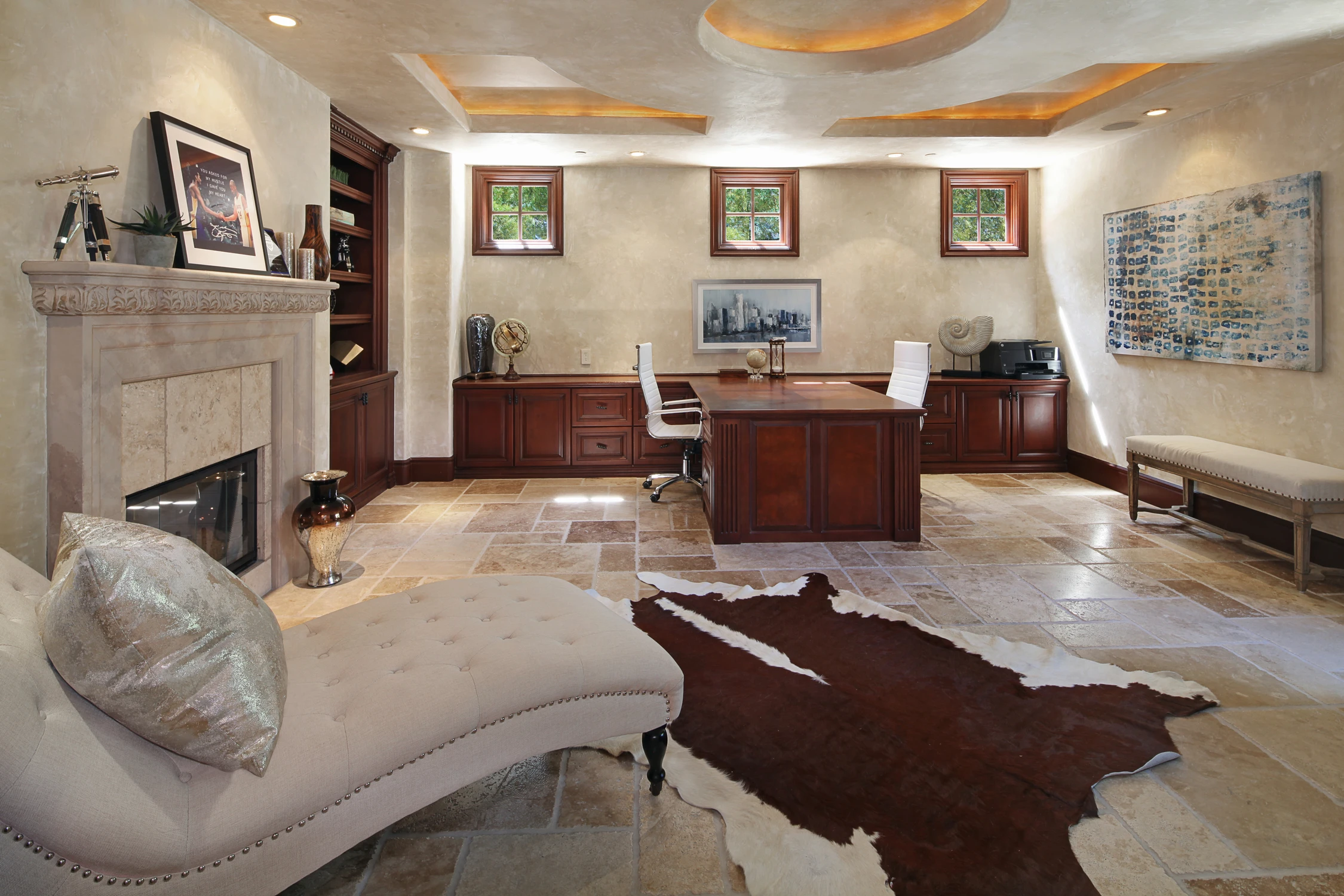 Formal living room with curved sofa, fireplace, and framed artwork