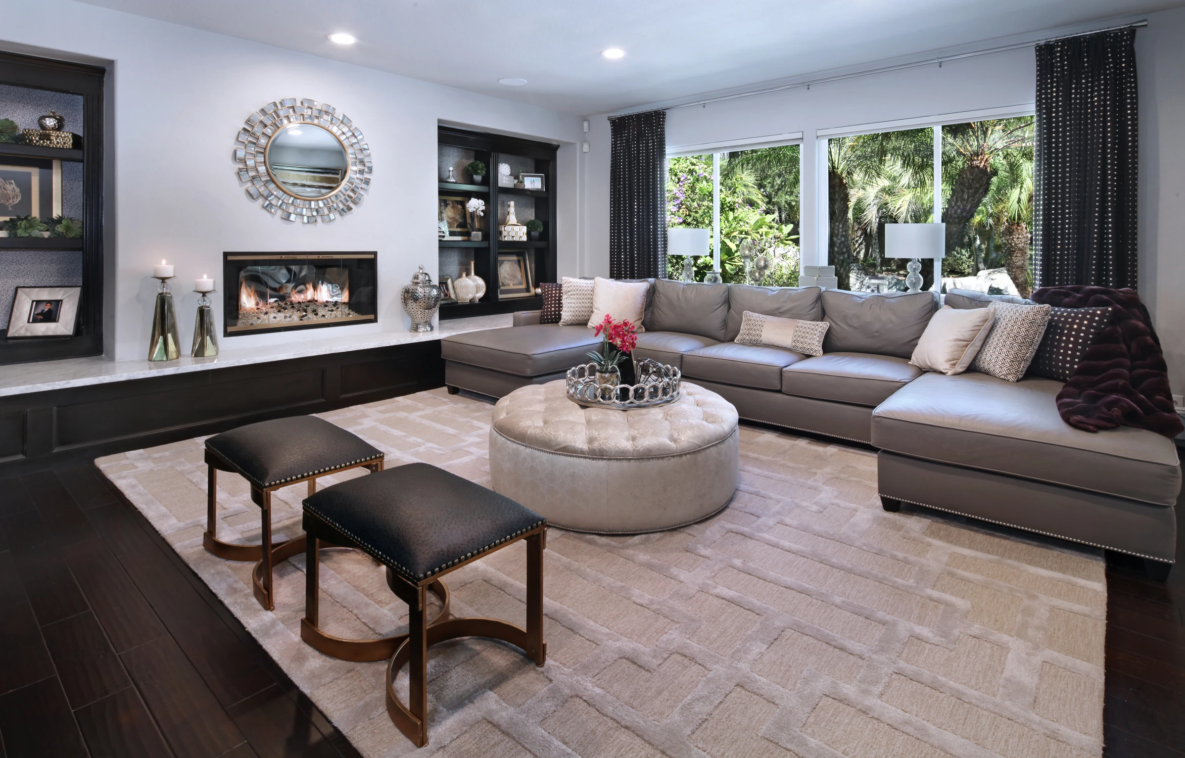 Family room with sectional sofa and black built-in cabinets