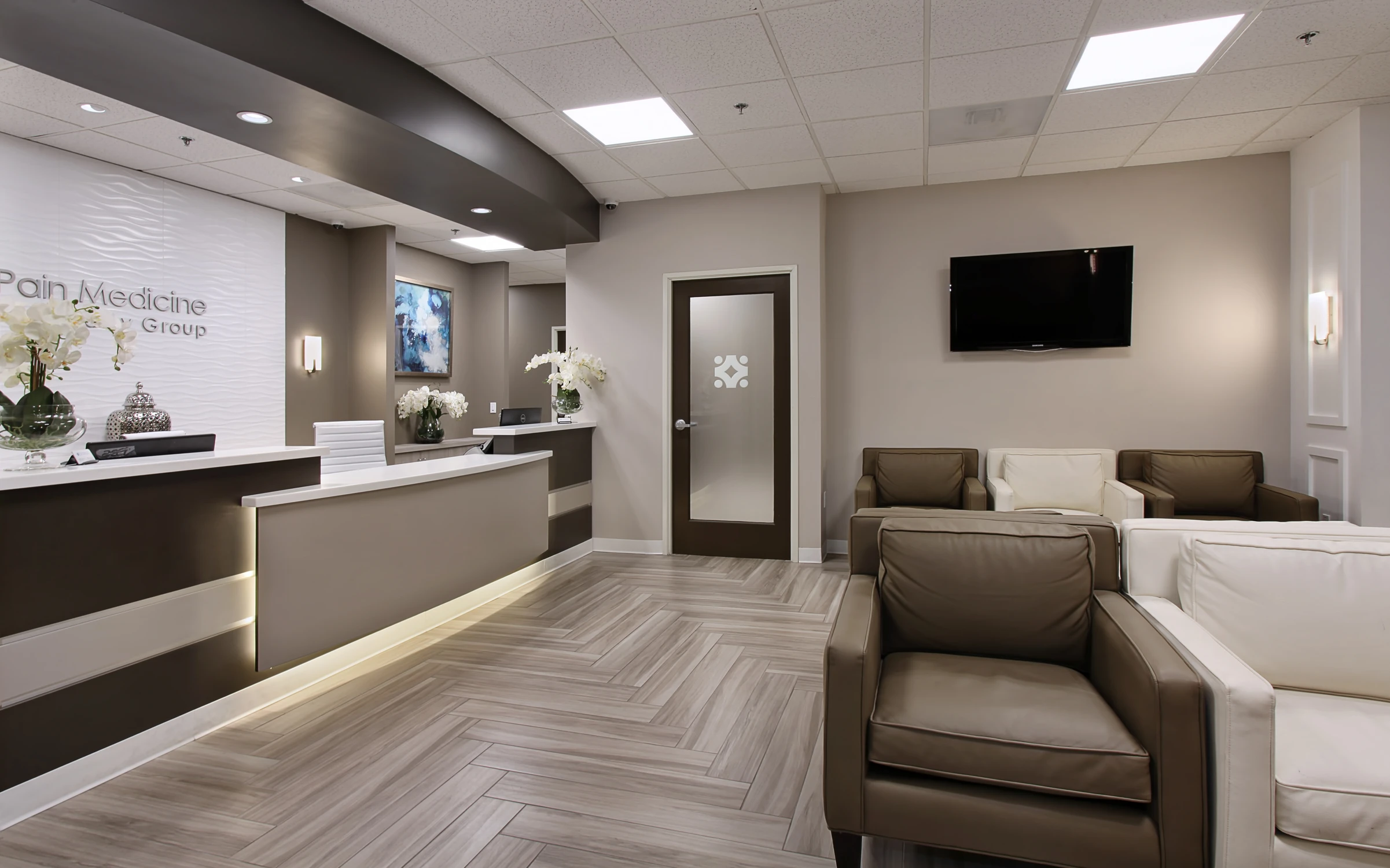 Reception desk and waiting room seating in medical office