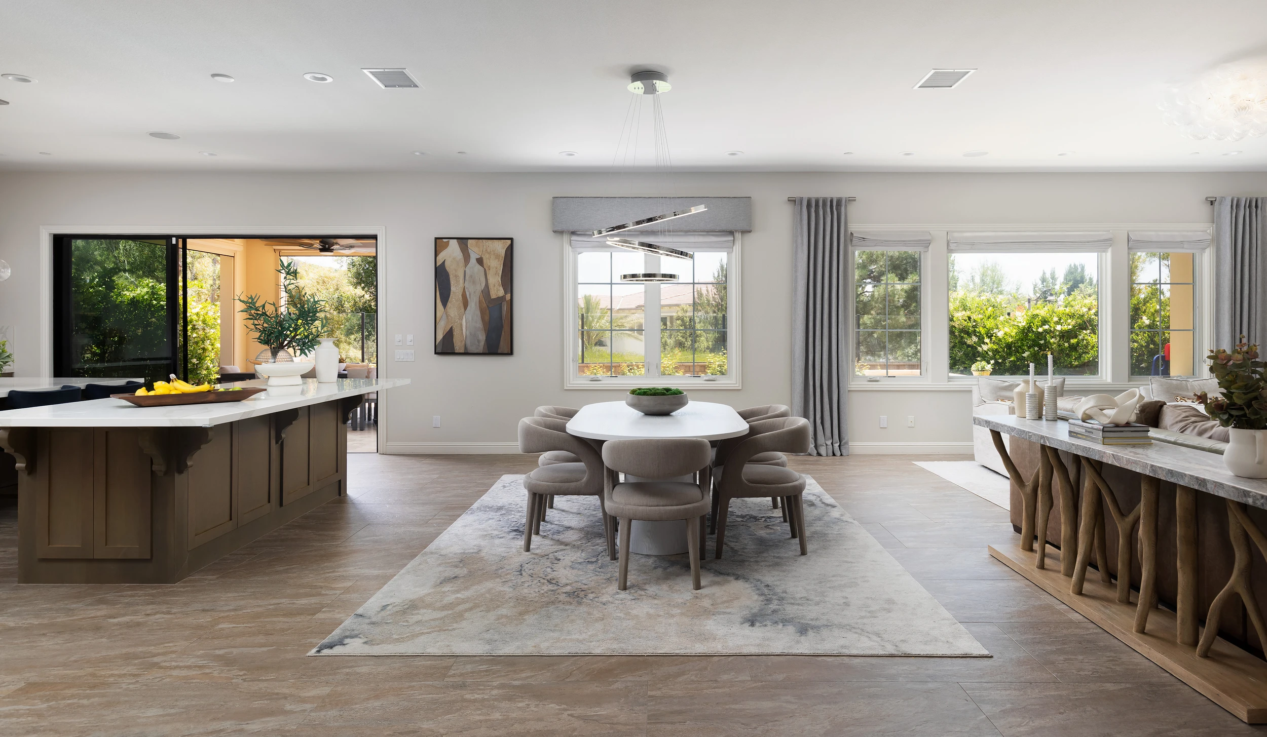Round dining table between the kitchen and living room