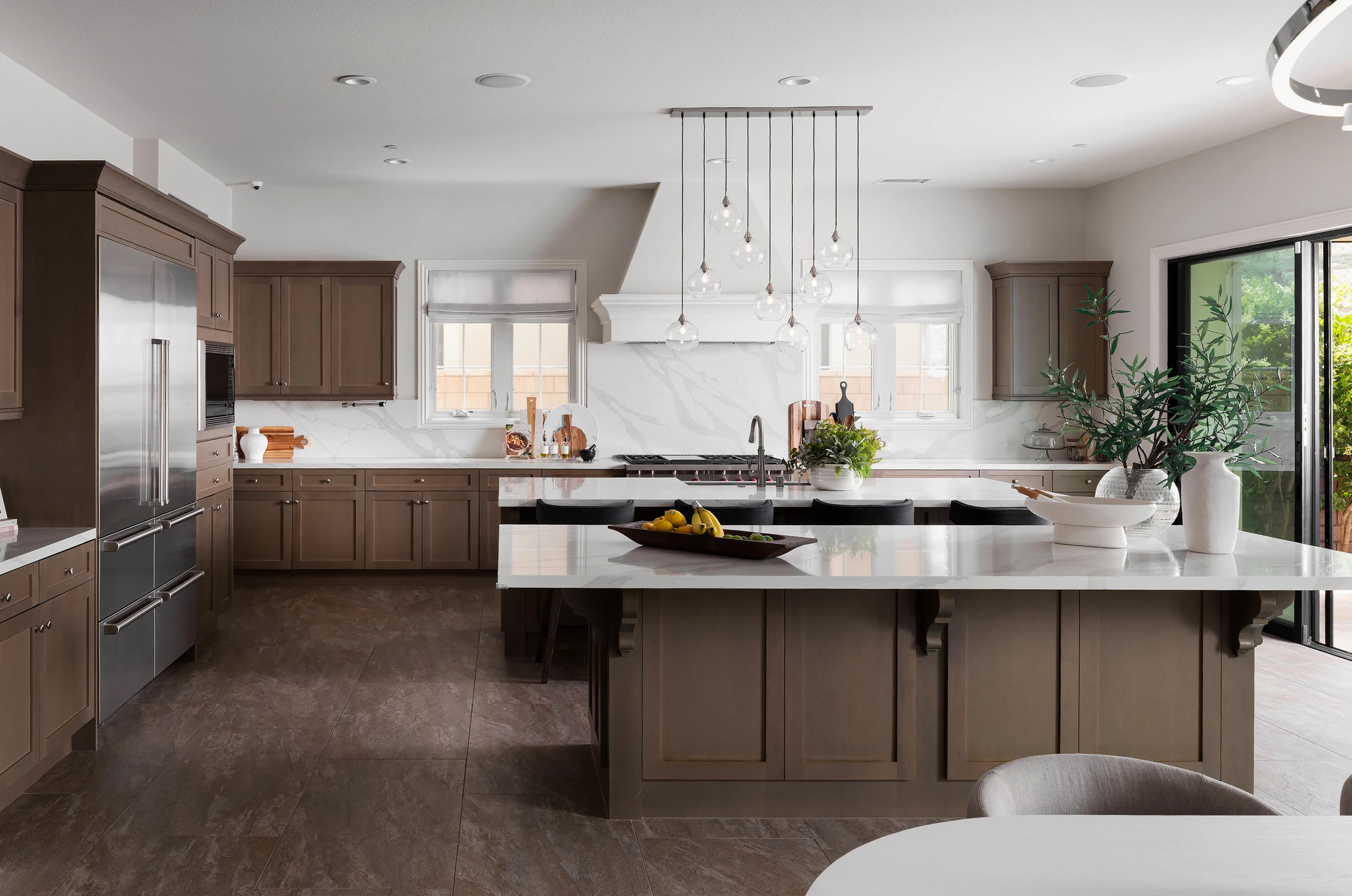 Kitchen with dual islands and glass doors to the patio