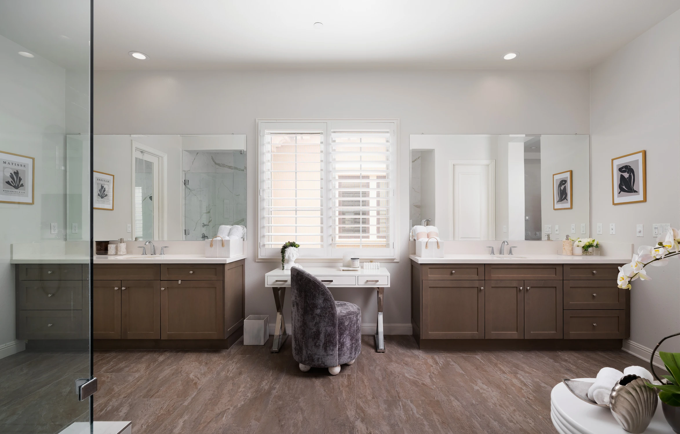 Master bathroom vanity with central window and double mirrors
