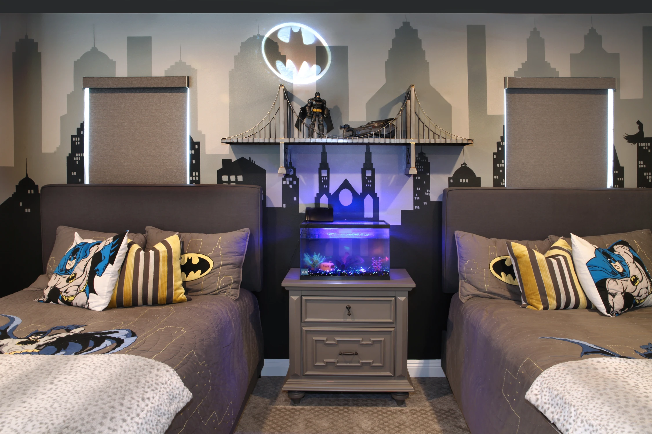 Children's bedroom detail with dark themed headboards and blue accent lighting